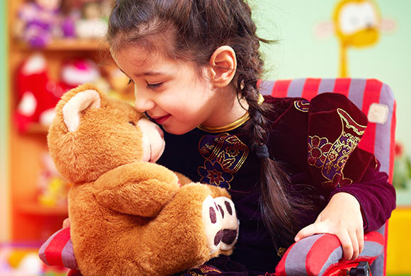 little girl with teddy bear